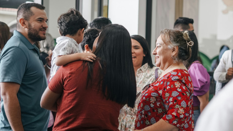 Family at a community event meeting